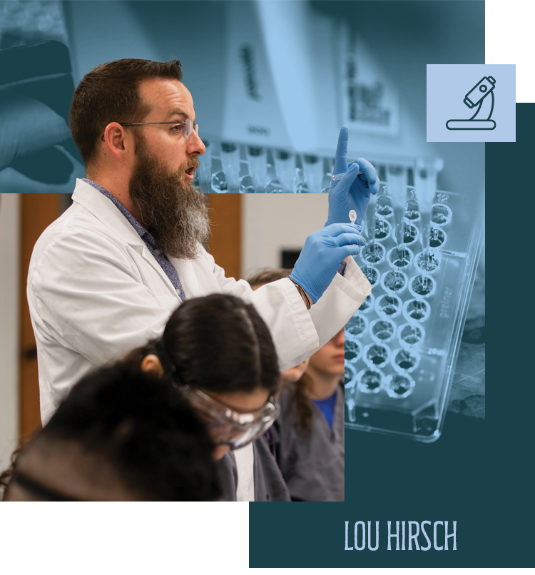 Lou Hirsch holding up a specimen in front of a class