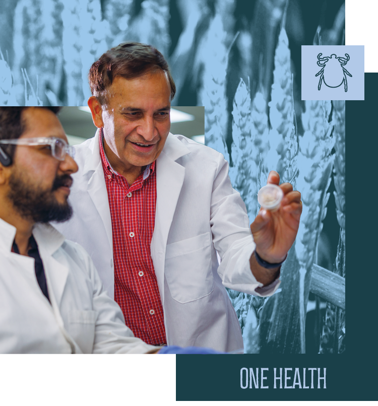 Reddy Palli and a student holding up a bacteria slide